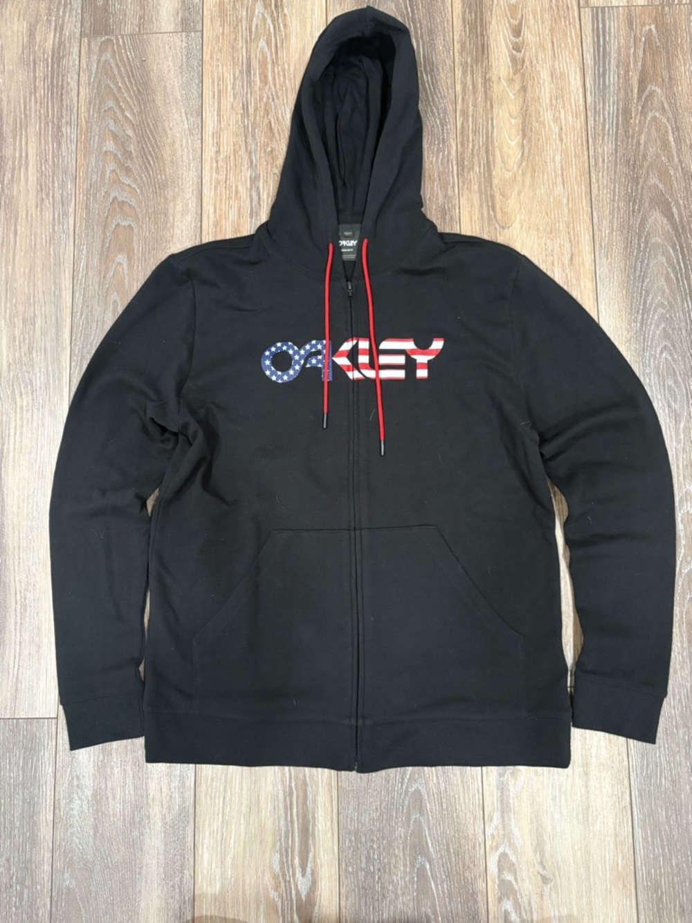 Oakley Black Hoodie with American Flag Logo and Red Drawstrings